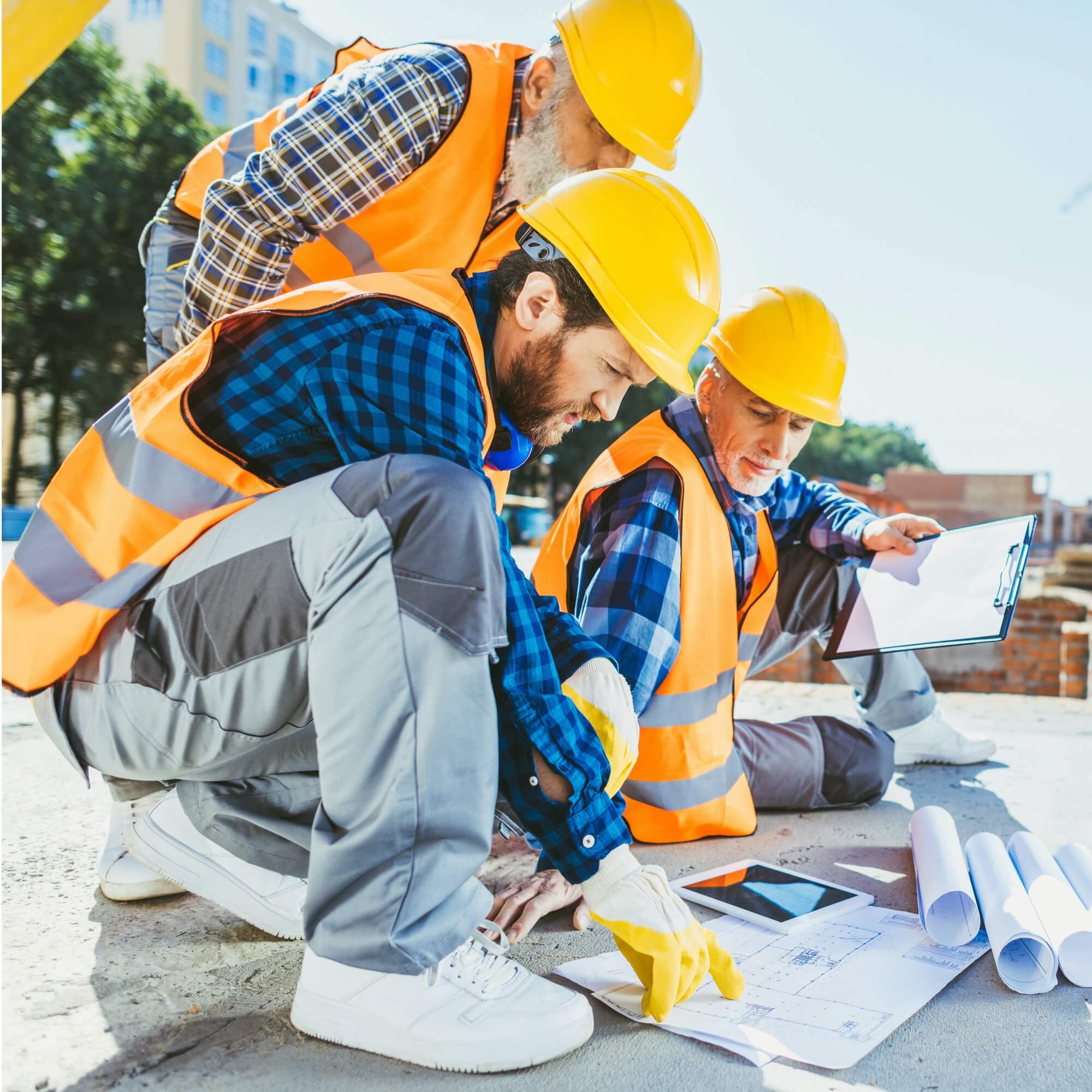 handsome-construction-workers-sitting-on-concrete-at-construction-site-discussing-building-plans-1.jpg handsome-construction-workers-sitting-on-concrete-at-construction-site-discussing-building-plans-1.jpg